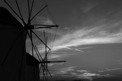 Low angle view of silhouette sailboat against sky during sunset