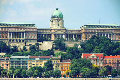 Buildings in city against sky