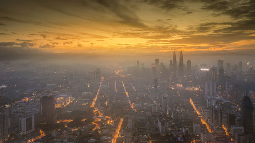 Aerial view of city at sunset