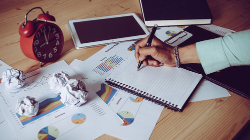 High angle view of man using laptop on table