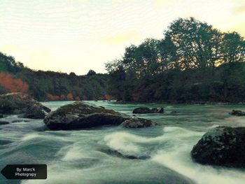 Scenic view of river against sky