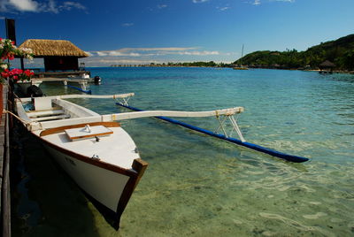 Boats moored in sea