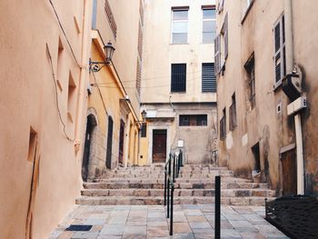 Narrow alley amidst buildings in city