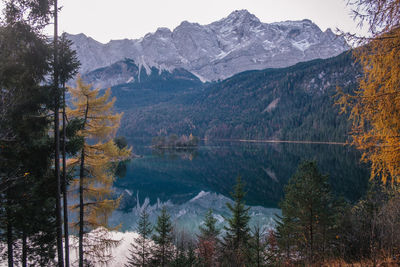 Scenic view of lake and mountains against sky