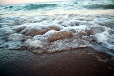 Close-up of wave on beach