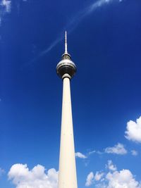 Low angle view of fernsehturm against blue sky