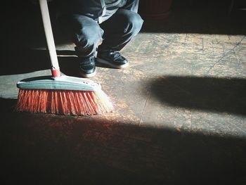 Low section of man working on floor