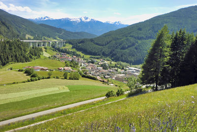 Scenic view of landscape and mountains against sky