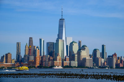 Modern buildings in city against sky