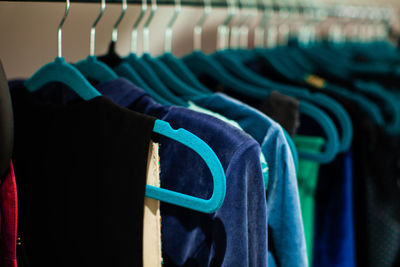 Close-up of clothes hanging on rack