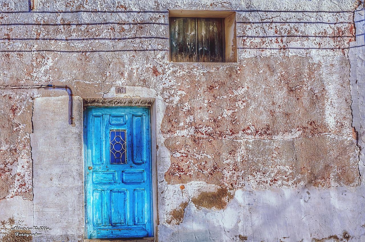 door, built structure, building exterior, entrance, architecture, wall - building feature, building, no people, closed, window, day, old, blue, house, weathered, security, protection, safety, outdoors, wood - material, turquoise colored