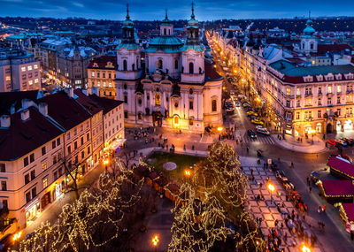 High angle view of illuminated christmas tree and buildings at night