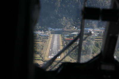 Aerial view of city seen through train window