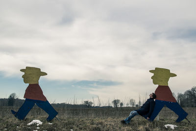 People on field against sky