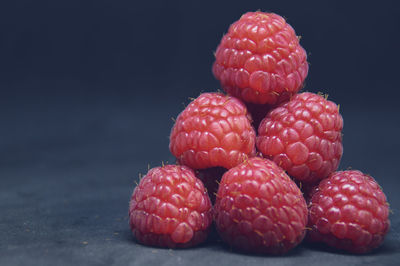 Close-up of fresh raspberries arranged in a pyramid