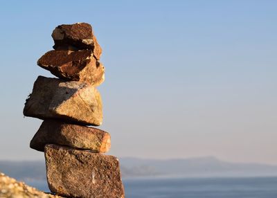 Stack of rocks against sky