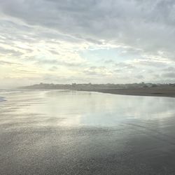 Scenic view of lake against sky at sunset