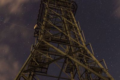 Low angle view of illuminated building against sky