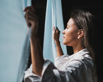 Portrait of young woman looking at camera