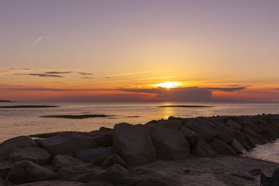 Scenic view of sea at sunset