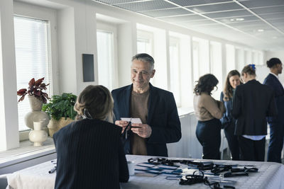 Man picking up his pass before conference