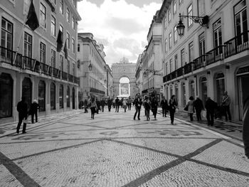 People roaming around city buildings