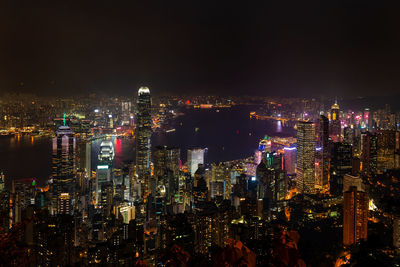 High angle view of city lit up at night