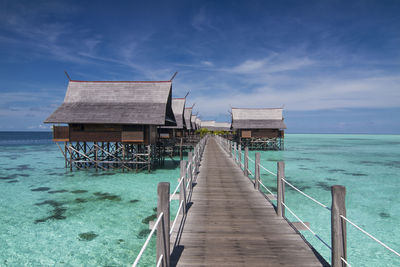 Pier over sea against sky