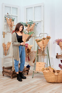 Woman standing in basket of store