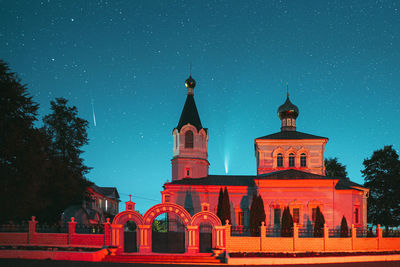 Traditional building against sky at night