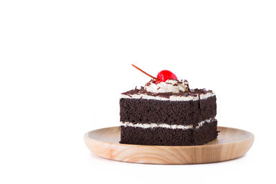 Close-up of chocolate cake against white background