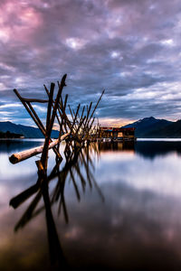 Scenic view of lake against sky at sunset