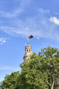 Low angle view of flag against sky