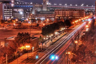 High angle view of light trails on city street at night