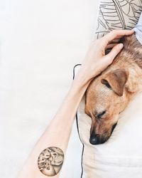 Close-up of human hand with tattoo