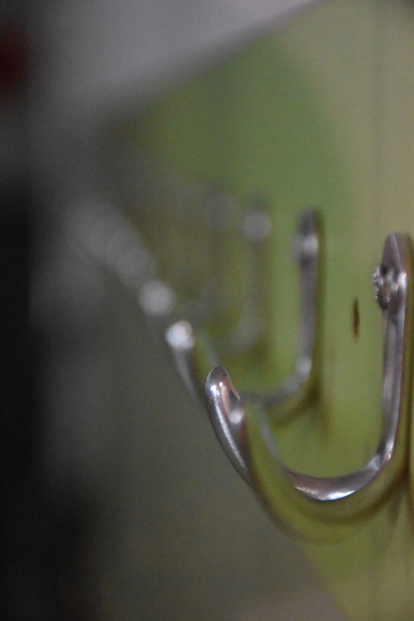 CLOSE-UP OF WATER DROPS ON METAL