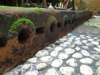 Close-up of rusty metal on rock