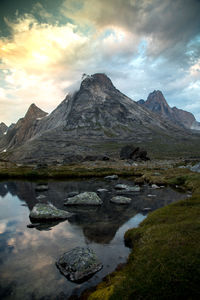 Scenic view of lake and mountains against sky