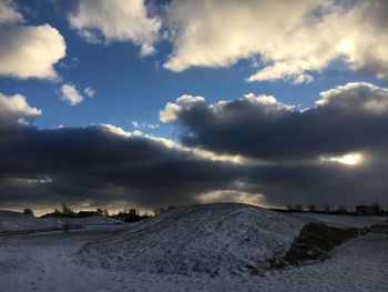 Scenic view of landscape against sky during winter