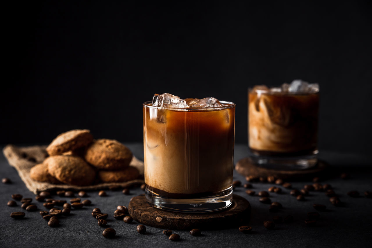 food and drink, drink, coffee, food, coffee - drink, refreshment, freshness, still life, indoors, sweet food, chocolate, table, indulgence, ready-to-eat, roasted coffee bean, no people, household equipment, glass, cookie, close-up, temptation, black background, latte