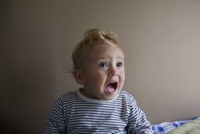 Cute girl screaming at home