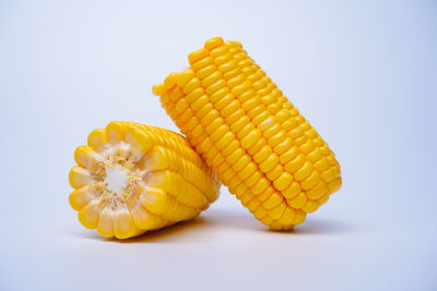 Close-up of yellow cake against white background