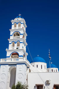 Low angle view of clock tower against sky