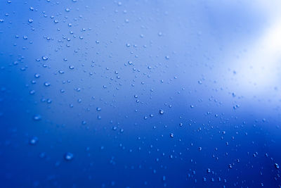 Full frame shot of wet glass window