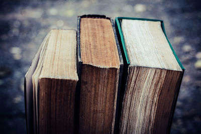 Ancient books on a wooden table , literacy and knowledge concept