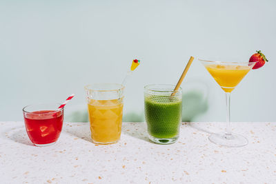 Healthy summer cocktails on terrazzo marble against wall at home