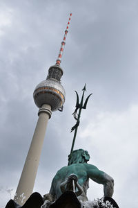 Low angle view of statue against cloudy sky