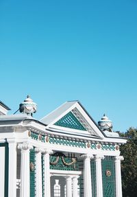 Low angle view of building against clear blue sky