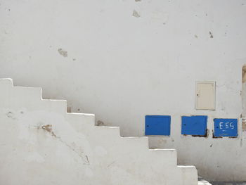 View of white wall with building in background