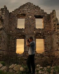 Woman looking at old ruins